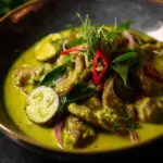 Delicious Thai Green Beef Curry served with rice and fresh herbs