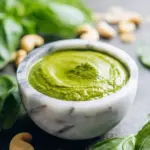 Bowl of Thai Red Curry Cashew Pesto with fresh ingredients